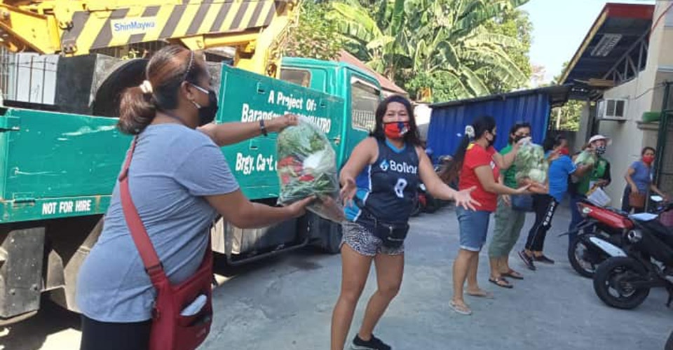 volunteers deliver food packages